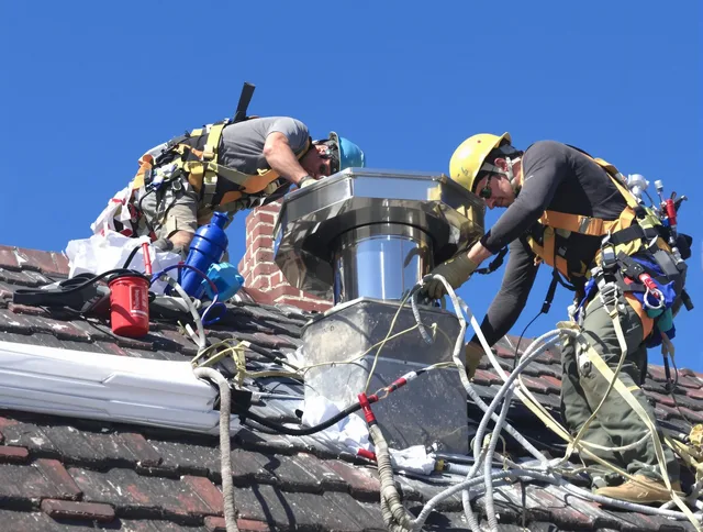 Protective chimney cap installed by Smithfield Chimney Sweep in Smithfield, RI