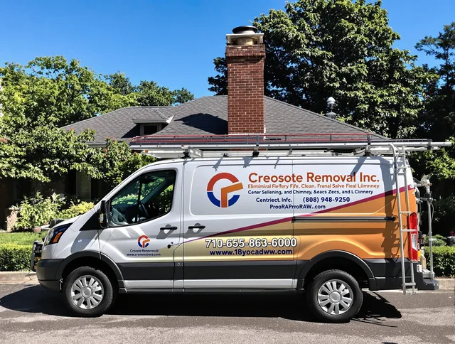 Smithfield Chimney Sweep technician removing creosote safely in Smithfield, RI