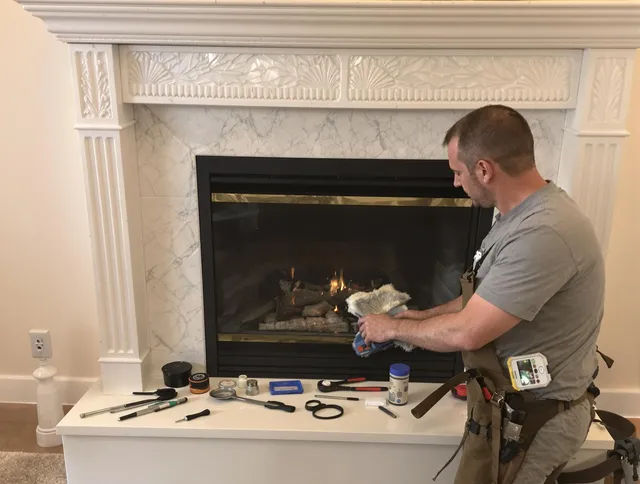 Smithfield Chimney Sweep performing fireplace maintenance in Smithfield, RI